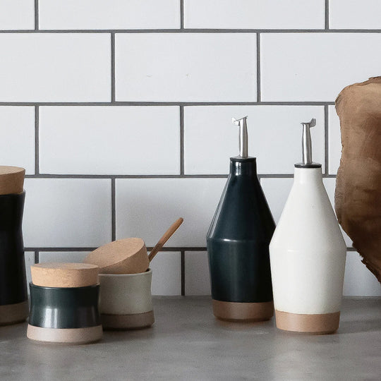 The Ceramic Lab Oil Bottle by Kinto is a stylish and functional accessory for your kitchen. This oil bottle is made of high-quality porcelain that is durable and easy to clean. The spout is designed to prevent dripping and control the amount of oil you pour. The bottle has a simple and elegant shape that complements any tableware.