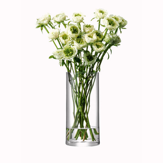 Lifestyle Image, The Column Vase from LSA is a contemporary, straight sided cylindrical vase made from clear mouth blown glass. The Column Vase features a heavy base, thick walls and cut and polished rims with all finishing done by hand. 