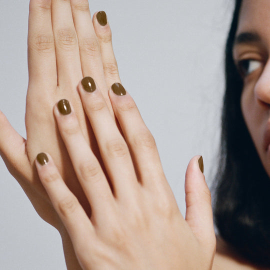 As Worn by Model, Compost nail polish by J.Hannah is an organic sludgy green, drawing influence from the idea of 'jolie laide' - literally 'pretty' and 'ugly'. Beauty is found outside of the conventional notion of attractiveness. 