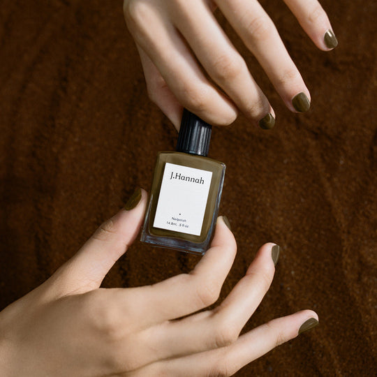In models hands, Compost nail polish by J.Hannah is an organic sludgy green, drawing influence from the idea of 'jolie laide' - literally 'pretty' and 'ugly'. Beauty is found outside of the conventional notion of attractiveness. 