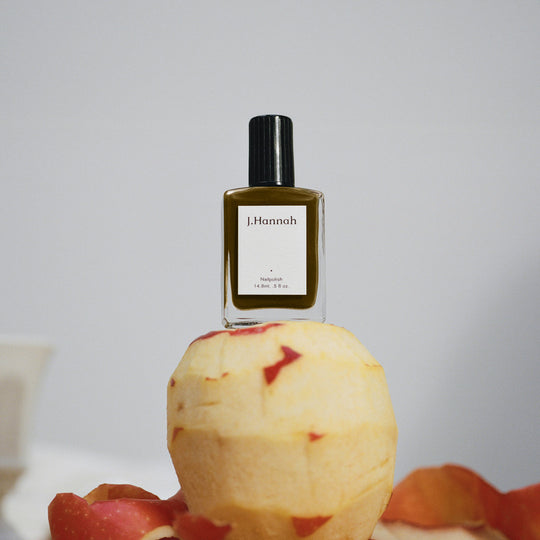 pictured on top of an peeled apple, Compost nail polish by J.Hannah is an organic sludgy green, drawing influence from the idea of 'jolie laide' - literally 'pretty' and 'ugly'. Beauty is found outside of the conventional notion of attractiveness. 