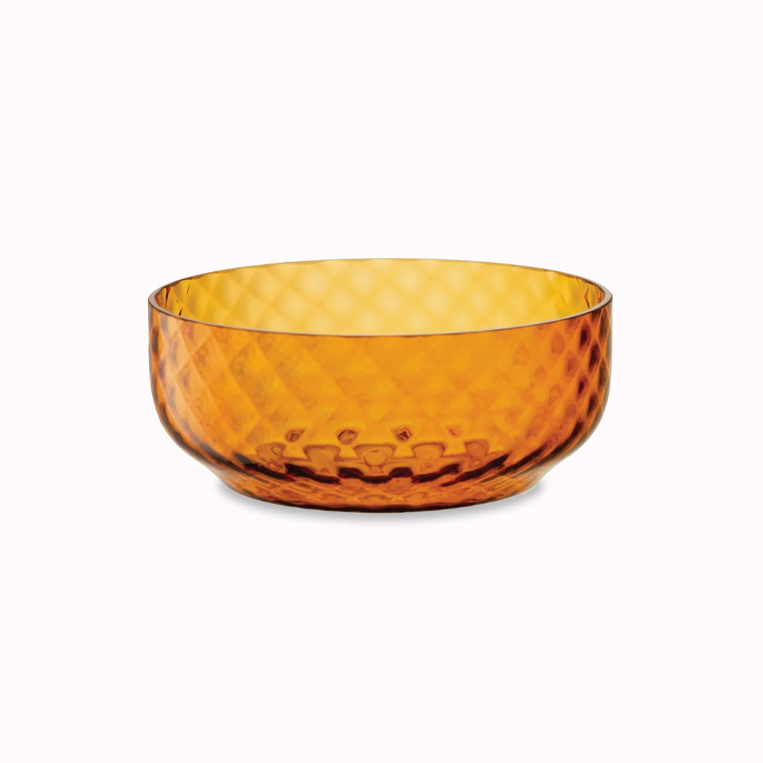 The Dapple Bowl is a lattice textured small serving or fruit bowl made from coloured amber yellow mouth-blown glass. The Dapple Bowl features a beautiful undulating textured surface that is inspired by dappled sunlight on water.