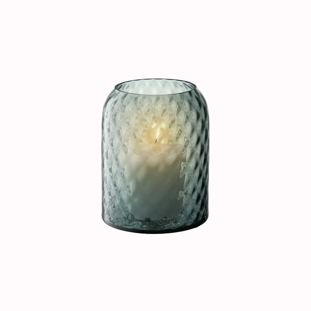 Dapple - Water Blue Vase. This medium sized vase is perfect for floral arrangements but can equally be used as candle lantern where the textured surface creates a patterned glow in a room.