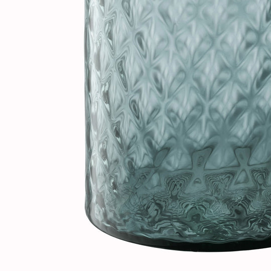 Dapple - Water Blue Vase. This medium sized vase is perfect for floral arrangements but can equally be used as candle lantern where the textured surface creates a patterned glow in a room.