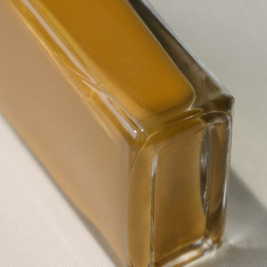 Detail of Bottle. Fauna nail polish by J.Hannah is a soothing ochre shade, drawing influence from warming and healing spices such ginger and turmeric.