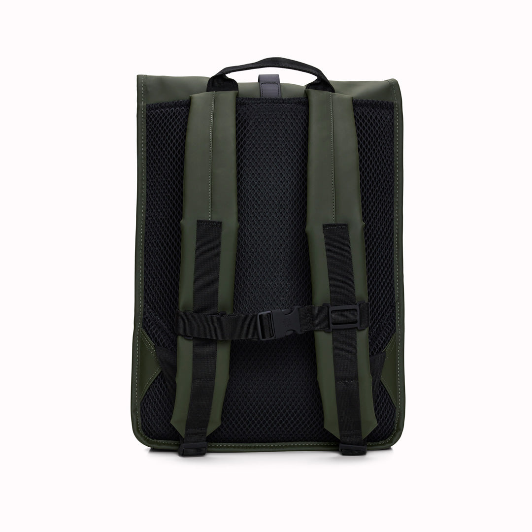 Rear View of Green Rolltop Rucksack. Made from Rains’ signature waterproof fabric, this functional backpack has a roll-top closure with an adjustable strap featuring a loop for a bike lock or similar. It has a large main compartment, and an easy-access front pocket and side-access laptop compartment both with a water-repellent zipper closure.