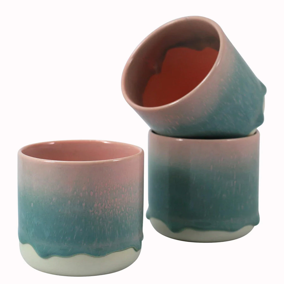 Collection of Rose Leaf Quench Mugs, This delicate green mug with pink rim is handmade in Denmark - meaning glaze colour and finish will never be exactly the same on any two items, but this is absolutely a part of their unique appeal.