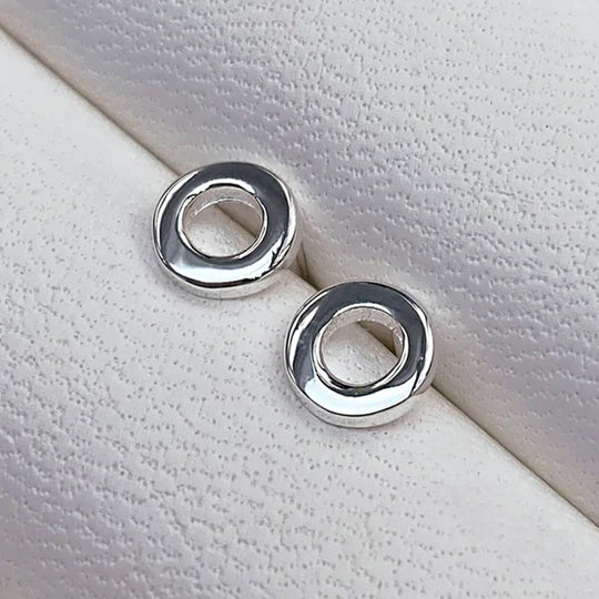 Simple Loop Stud earrings in Sterling Silver by Matthew Calvin. A minimalist geometric design with high polish silver finish.
