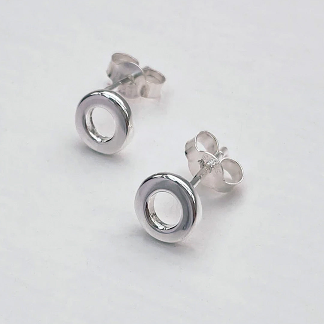Simple Loop Stud earrings in Sterling Silver by Matthew Calvin. A minimalist geometric design with high polish silver finish. - detail