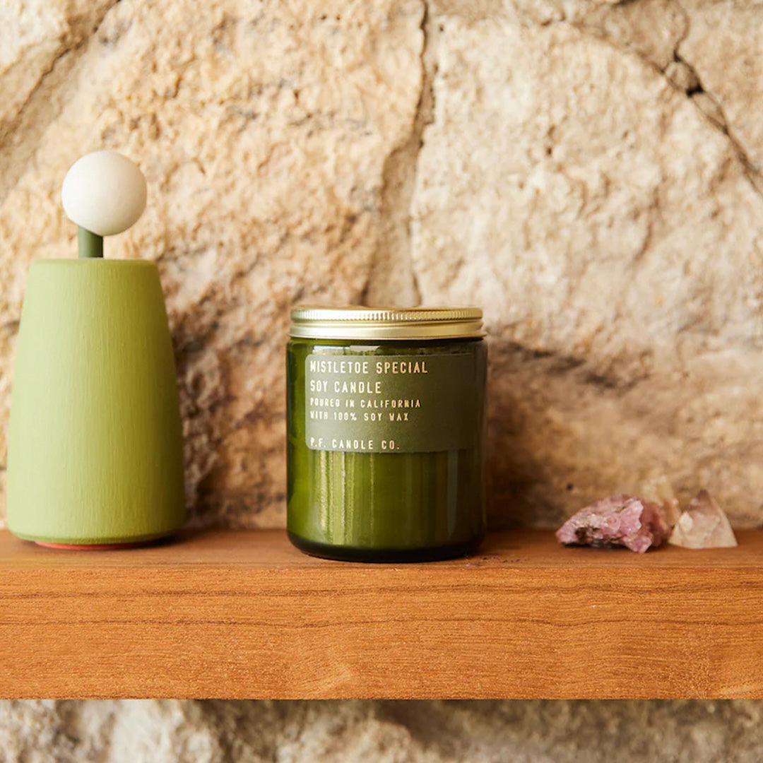 P.F. Candle Co Mistletoe Special Christmas candle has fragrance notes of Douglas Fir, Eucalyptus, Pine and Cedar, reminiscent of fresh winter walks in the woods. A cosy option for family get togethers over the festive season. Lifestyle on shelf