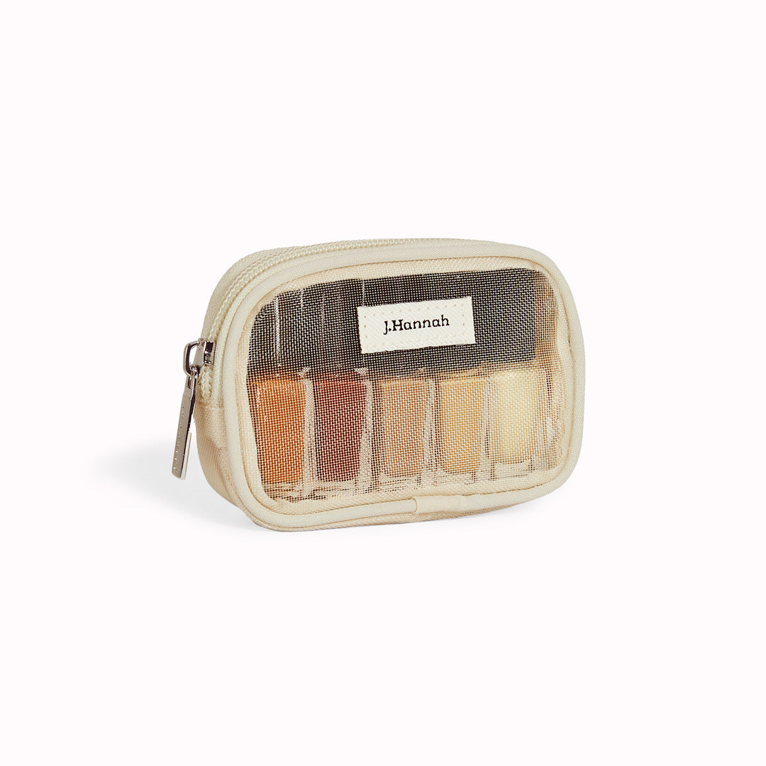 The Classics Mini Nail Polish Set by J.Hannah includes five of their classic colour shades in petite bottles: Akoya, Dune, Fauna, Ghost Ranch and Miso. Packaged in a reusable mesh zipper pouch, the Classics Mini Polish Set is designed for gifting and travel.