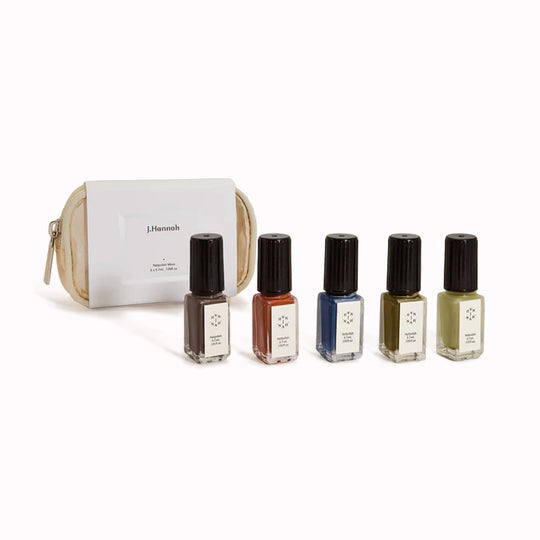 The Rarities Mini Nail Polish Set by J.Hannah includes five of their richest colour shades in petite bottles: Compost, Blue Nudes, Carob, Eames, and Ghost Ranch. Packaged in a reusable mesh zipper pouch, the Rarities Mini Polish Set is designed for gifting and travel.