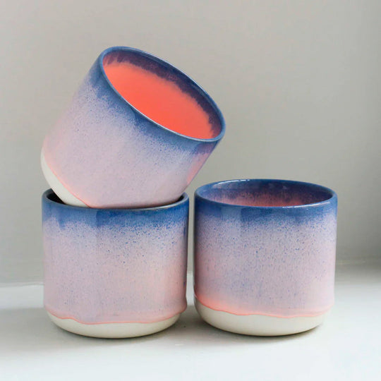 Group of blue rimmed, mainly pink mug is handmade in Denmark - meaning glaze colour and finish will never be exactly the same on any two items, but this is absolutely a part of their unique appeal.