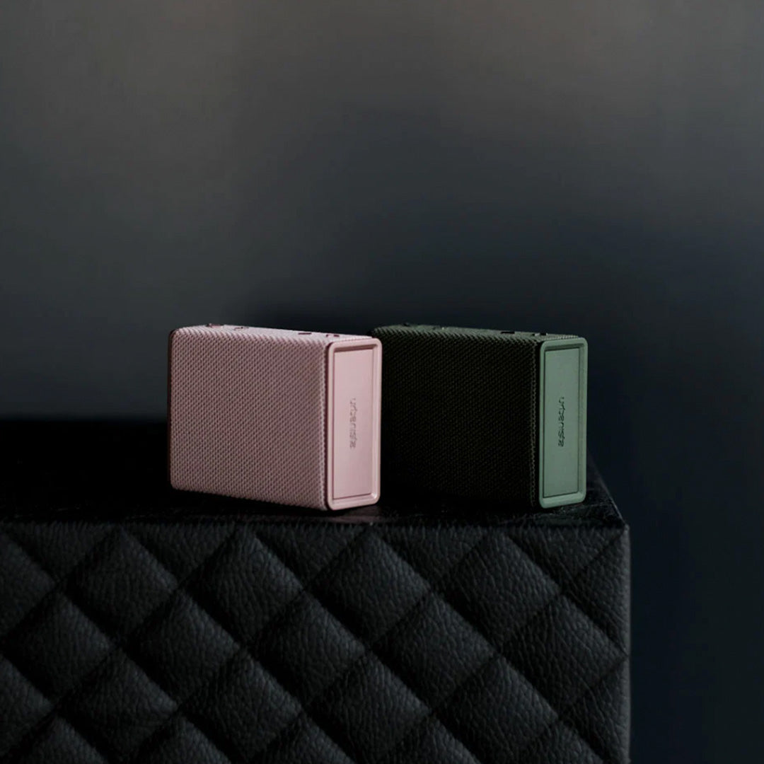 Sleek and miniature Rose Gold and Olive green Bluetooth travel speaker from Urbanista. Like all Urbanista products it has a stripped back and minimal aesthetic so perfect for the style conscious.