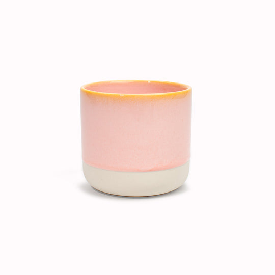 The yellow rimmed, pink drip glazed Quench Cup is handmade in Denmark - meaning glaze colour and finish will never be exactly the same on any two items, but this is absolutely a part of their unique appeal.