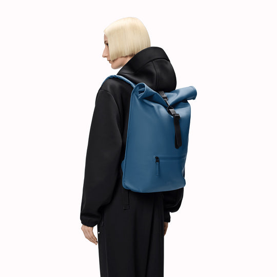 Rolltop Rucksack is Rains’ take on a cycling backpack. Made from Rains’ signature waterproof fabric, this functional backpack has a roll-top closure with an adjustable strap featuring a loop for a bike lock or similar.