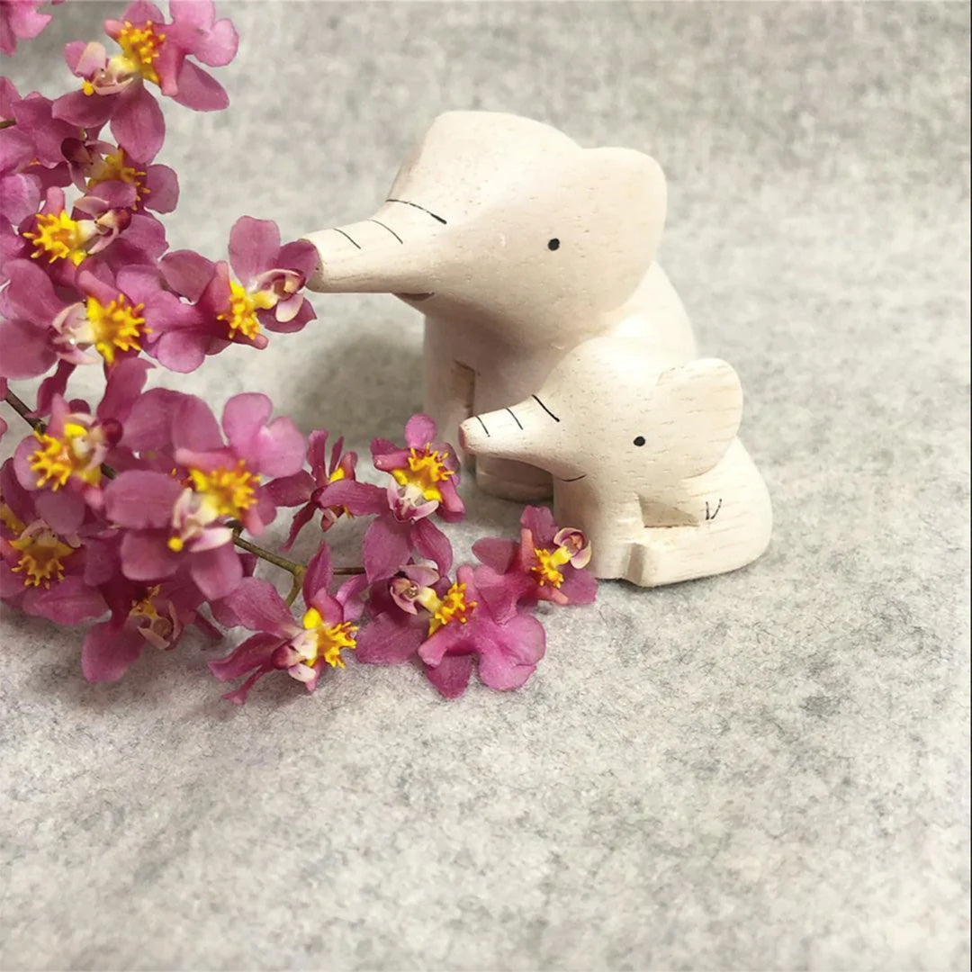 ute handmade wooden sitting Elephant from the Pole Pole collection by Japanese brand T-Lab. Goes well with the baby elephant figurine as a family.