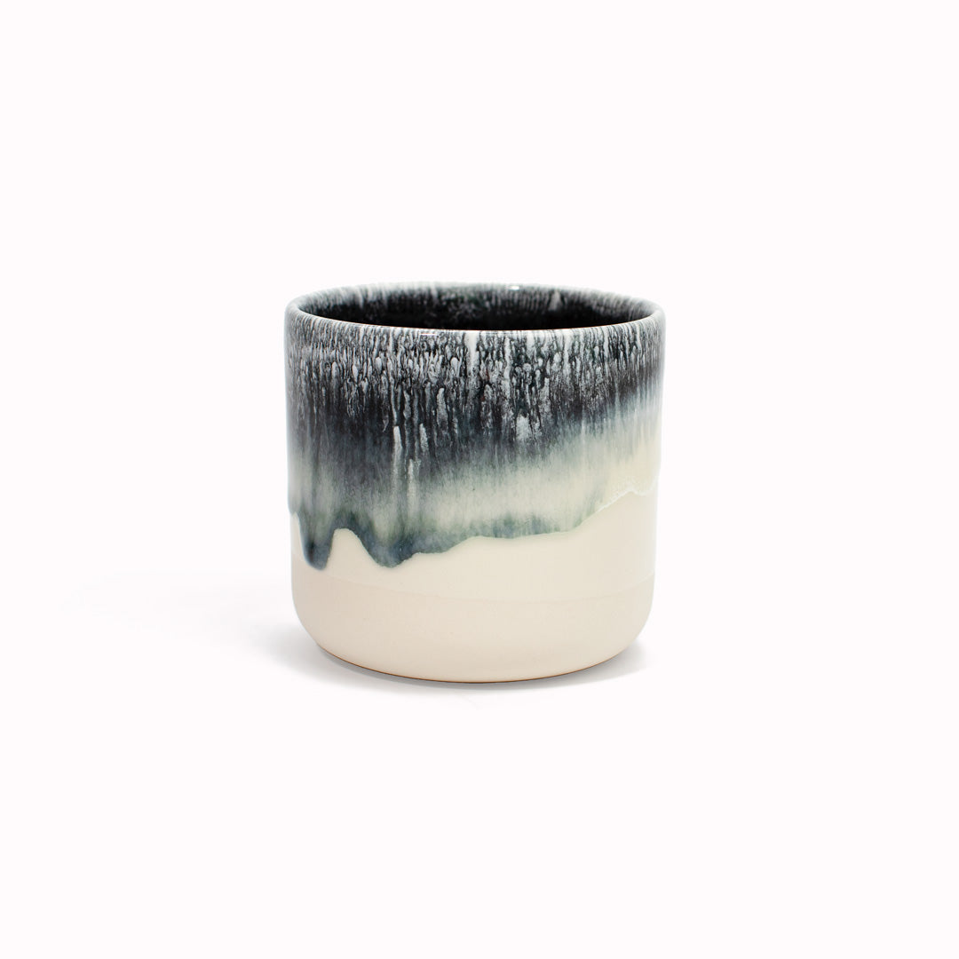 The monochrome Stargazer Quench Cup is handmade in Denmark - meaning glaze colour and finish will never be exactly the same on any two items, but this is absolutely a part of their unique appeal.