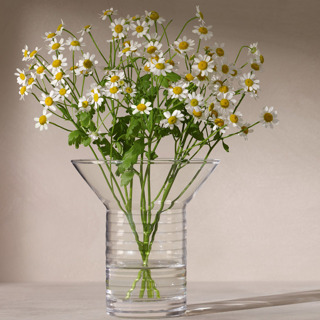 Union Vase with flowers. A small contemporary vase that combines a finely ribbed body with a smooth flared collar. Designed for posies, stems and foliage. 