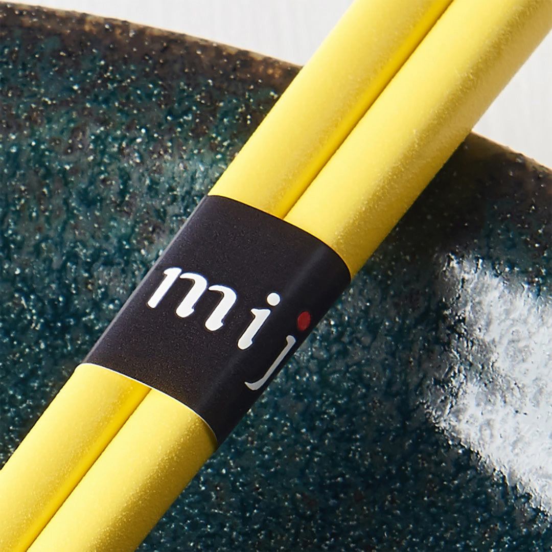 Yellow Textured Lacquerware Chopsticks from Made in Japan. This Chopstick collection is designed and made at the Zumi workshop in Fukui prefecture, Japan. This region of Japan has a 1500-year-old history of crafting with Lacquer.  Close Up