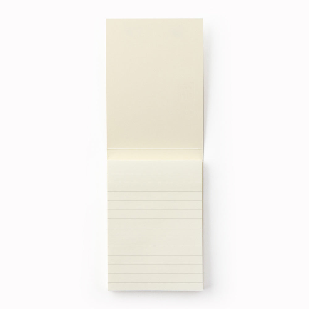 A7 memo pad with lined sheets. Designed to work alongside the MD Paper notebook series, it uses the same quality paper and same grid layout so you can seamlessly add notes into pages in your MD Paper Lined notebook. It is sticky on one side, but you can write on both sides. 80 tear off pages. Showing lined pages.