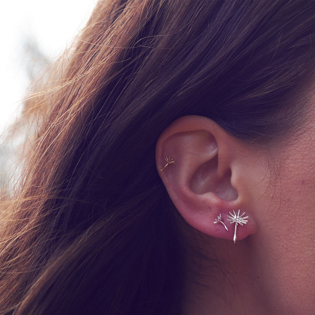 Asymmetric Dandelion Fluff Sterling Silver Stud Earrings being worn by a model by Alex Monroe