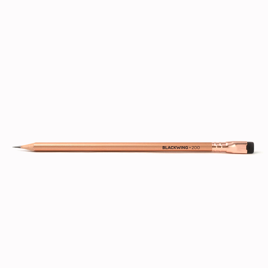 A single Blackwing Vol. 200 pencil featuring a metallic copper design inspired by classic copper coffee roasting machines which is a tribute to the coffeehouses of the Beat Generation in NY