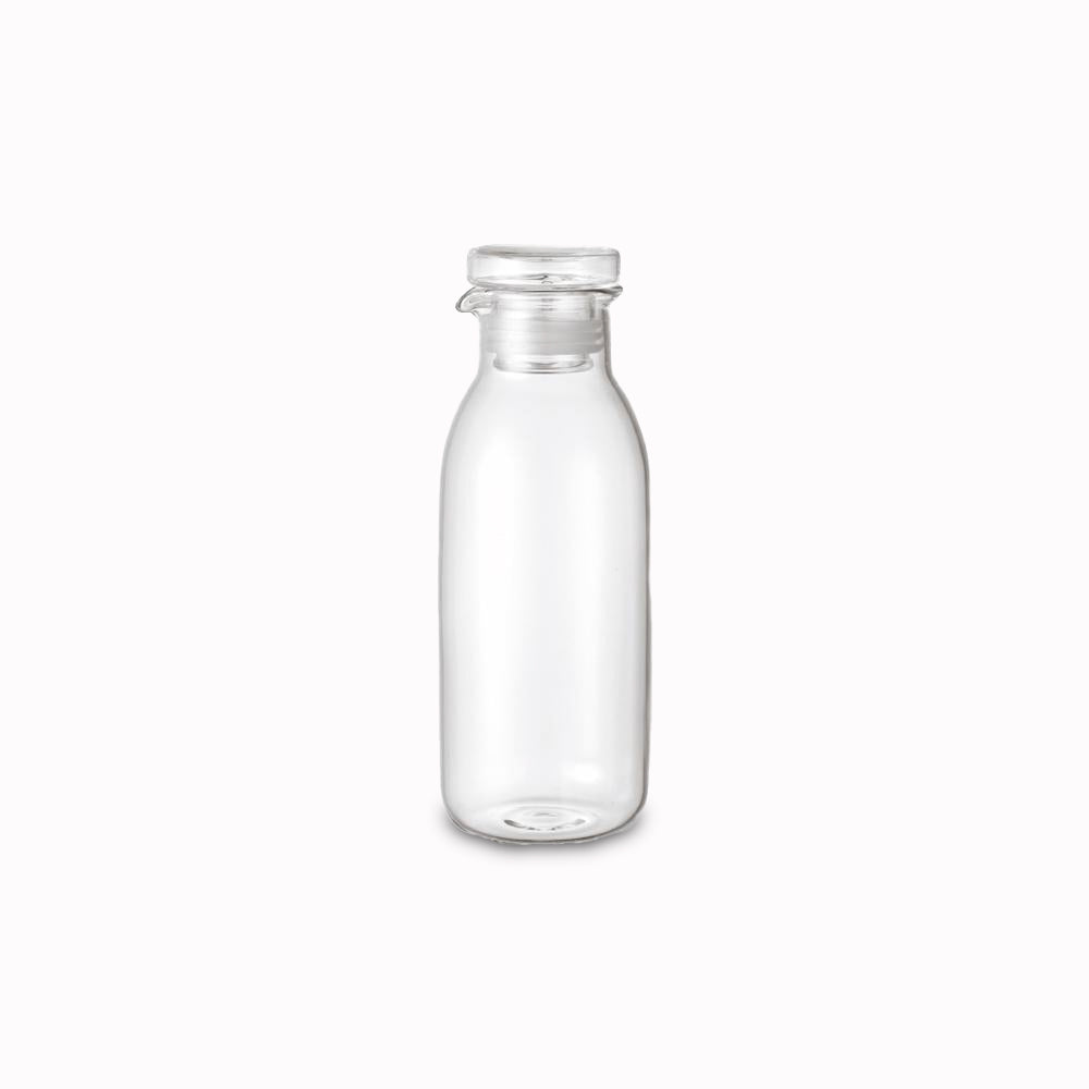 Large heat resistant glass bottle with air tight lid and pourer, suitable for salad dressing. Silicone rim on lid for a snug fit from Kinto - Japanese Tableware
