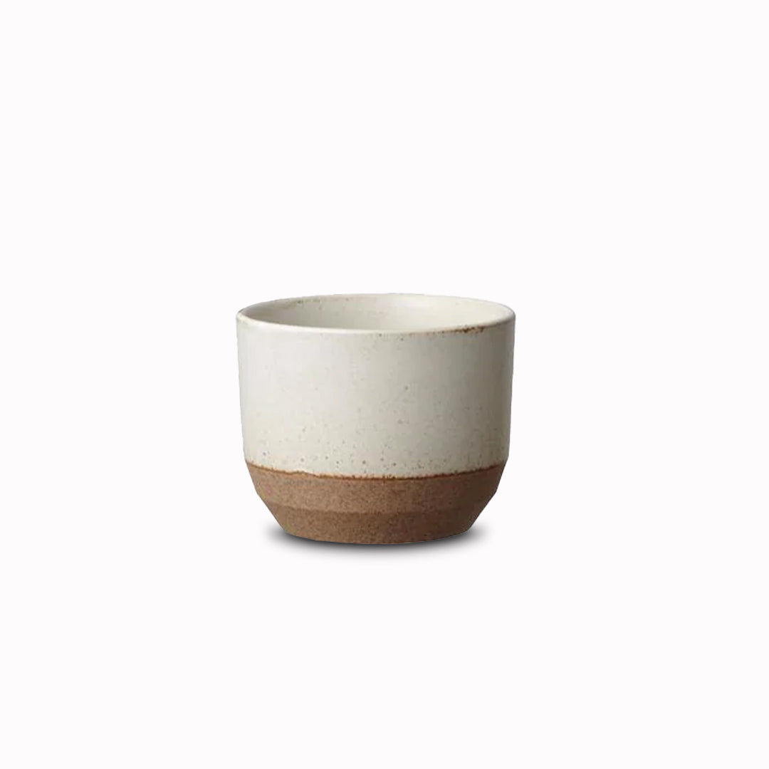 Ceramic Lab Tumbler in White from Kinto. This porcelain mug uses sandstone unique to the Hasami region in Japan. It gives the product a beautiful rough quality whilst also being delicate and a pleasure to use.