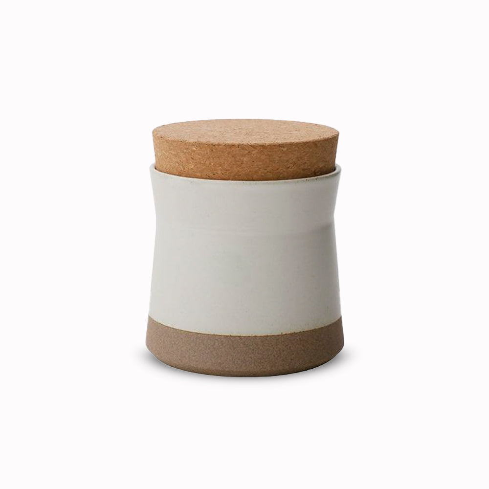 Ceramic Lab Canister in White from Kinto, this porcelain mug uses sandstone unique to the Hasami region in Japan. It gives the product a beautiful rough quality whilst also being delicate and a pleasure to use.