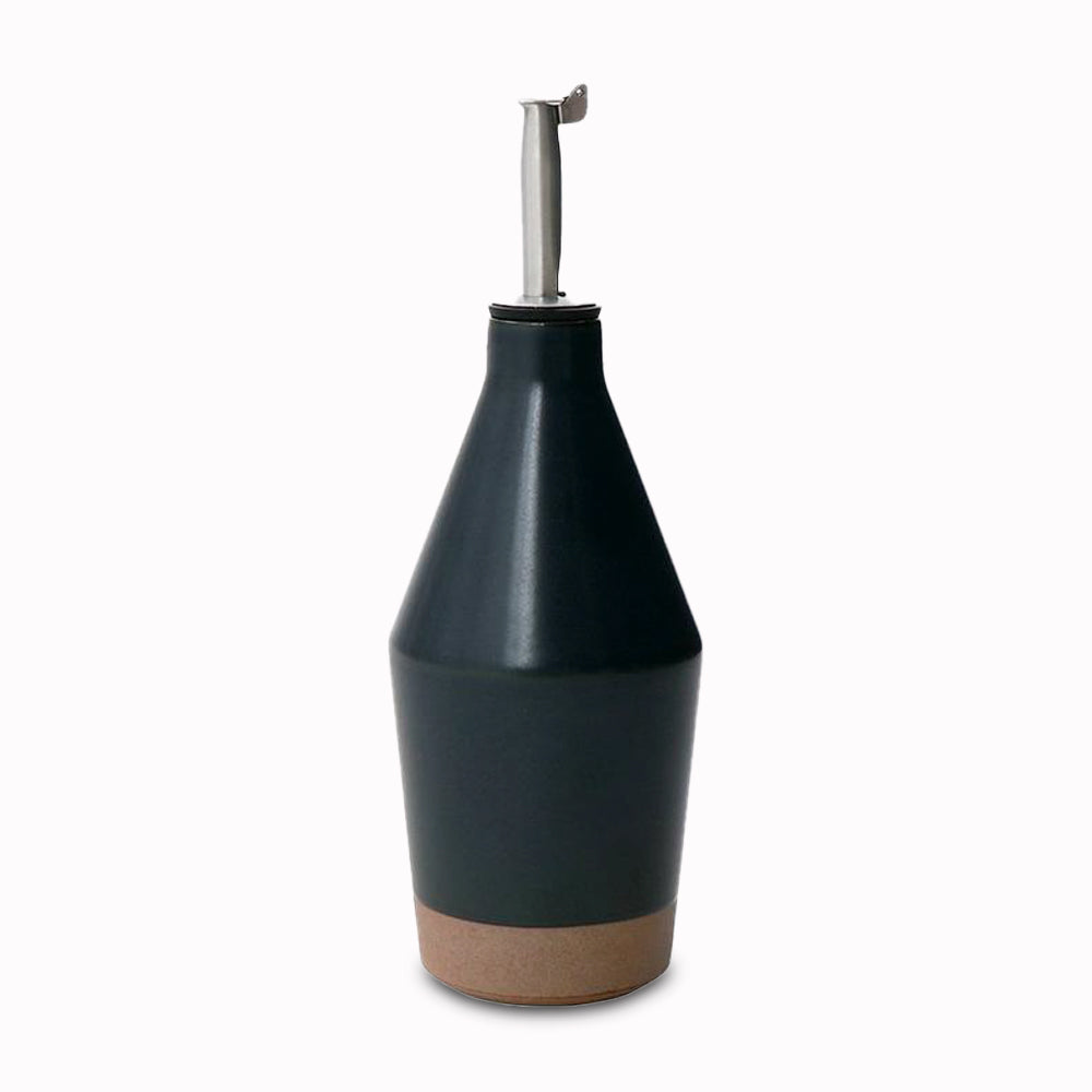 Table salad oil pourer by Kinto, using sandstone unique to the Hasami region in Japan. It gives the product a beautiful rough quality whilst also being delicate and a pleasure to use.  