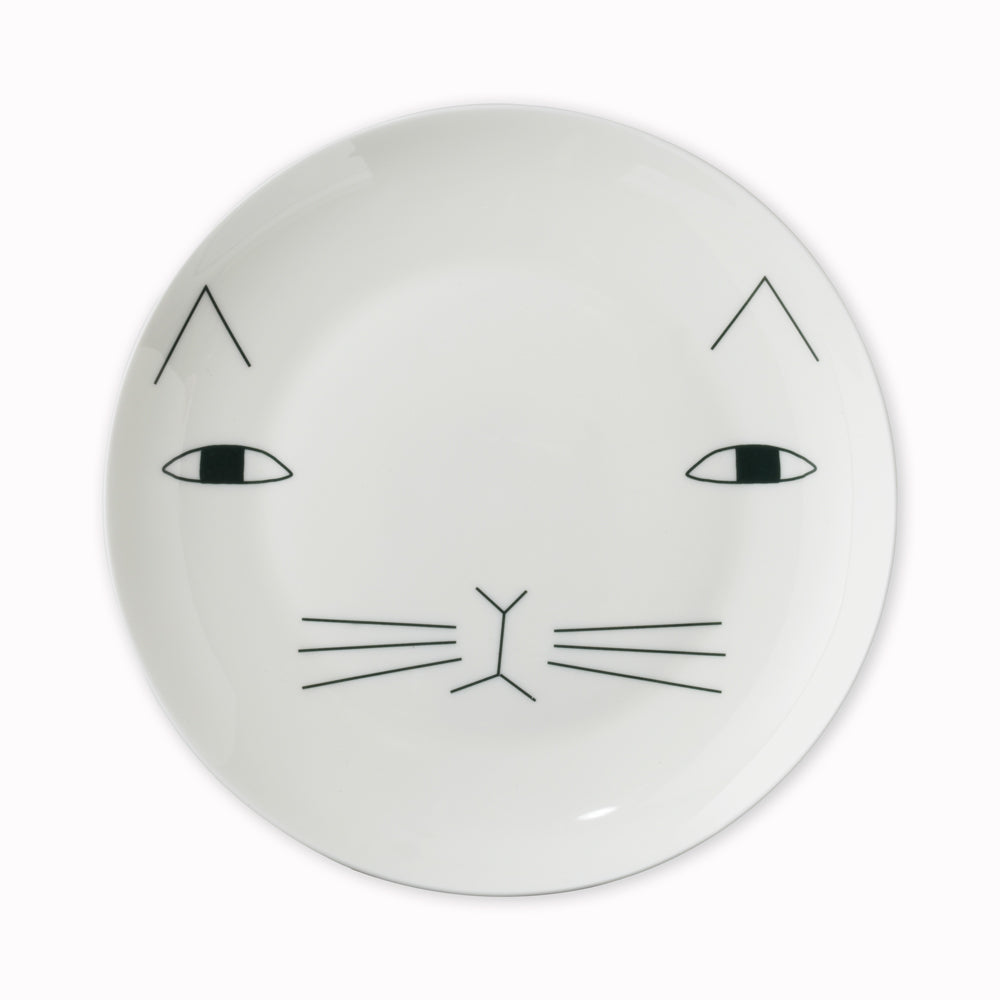 Mog the Cat bone china plate by Donna Wilson. He looks somewhat serious but we can assure you he's the perfect companion.  Pair your mug with a Mog Mug and Mog Egg Cup , or mix & match with other ceramics.