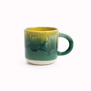 A bright green and yellow, heavy glazed, Japanese inspired ceramic mug from Studio Arhoj. The Chug Mug features their trademark thick, hand poured coloured glaze which means that each mug is unique.