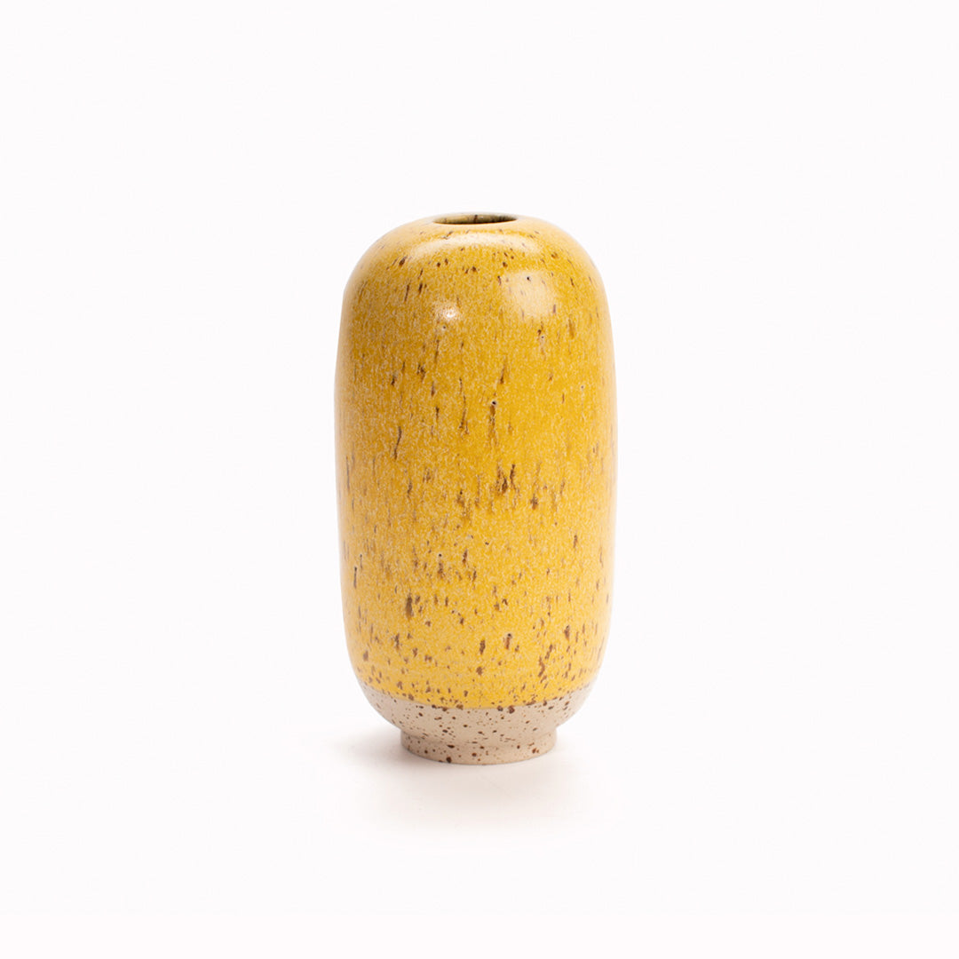 The deep speckled yellow 'Cornflower' design is hand-thrown in watertight stoneware and due to the rounded taper at the top of the vase, the glaze melts down the sides of the cylindrical vase mimicking melting ice.   Each piece is handmade in Denmark from the Arhoj studio in Copenhagen. This means the glaze colour and finish will never be exactly the same on any two items, and this is absolutely a part of their unique appeal. 