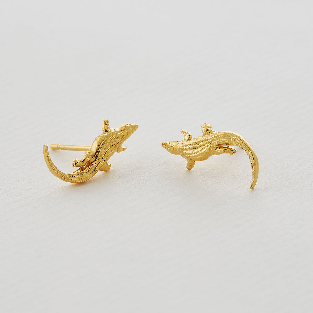 Two crocodiles curve sinuously towards one another in a pair of stud earrings, symbolising the power of new beginnings. Perfect for mixing and matching with other Alex Monroe earrings.
