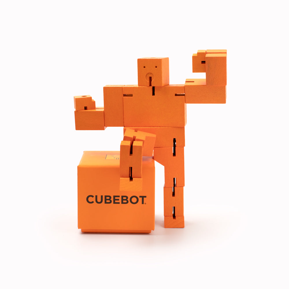Cubebot by Areaware is a fun wooden toy robot that folds out of a perfect cube shape. Part puzzle, part posable toy they are inspired by Japanese Shinto Kumi-ki puzzles and can be positioned to hold dozens of poses.   Made from Beech and elastic, water based paint. Posable and decorative. 17 cm tall, 23.5 cm arm span.