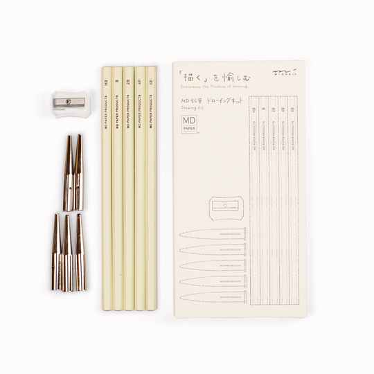 Stylish, minimal drawing set of pencils from Japanese stationery brand, MD Paper, in their trademark subtle off-white colour scheme. This set includes five graphite pencils in assorted hardness (6B, 4B, 2B, B, HB) with protective toppers and a sharpener.