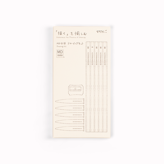 Showing box. Stylish, minimal drawing set of pencils from Japanese stationery brand, MD Paper, in their trademark subtle off-white colour scheme. This set includes five graphite pencils in assorted hardness (6B, 4B, 2B, B, HB) with protective toppers and a sharpener.