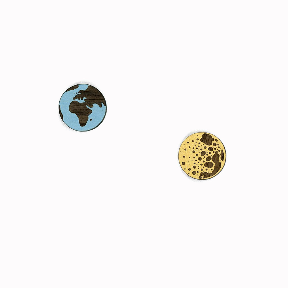 Earth & Moon stud earrings designed by Miriam Frank for Materia Rica. Inspired by illustration, the world of tattooing and the love of wildlife, Miriam Frank's designs have become beautiful earrings and necklaces. The walnut pieces have been laser cut and hand-painted in bright colours to create the quirky jewellery.