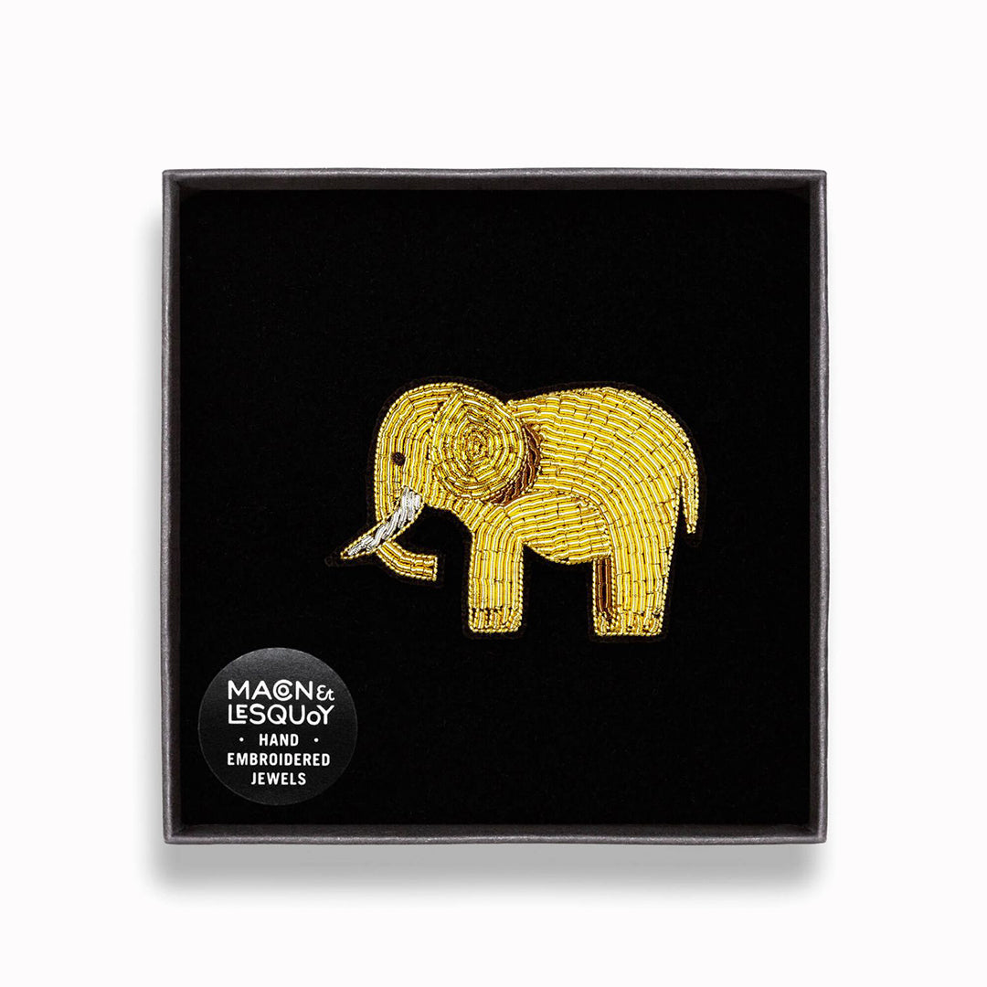 A beautifully hand-embroidered gold elephant lapel pin  in a presentation box From Macon & Lesquoy, French Hand Embroidered badges and patches using Cannetille thread.