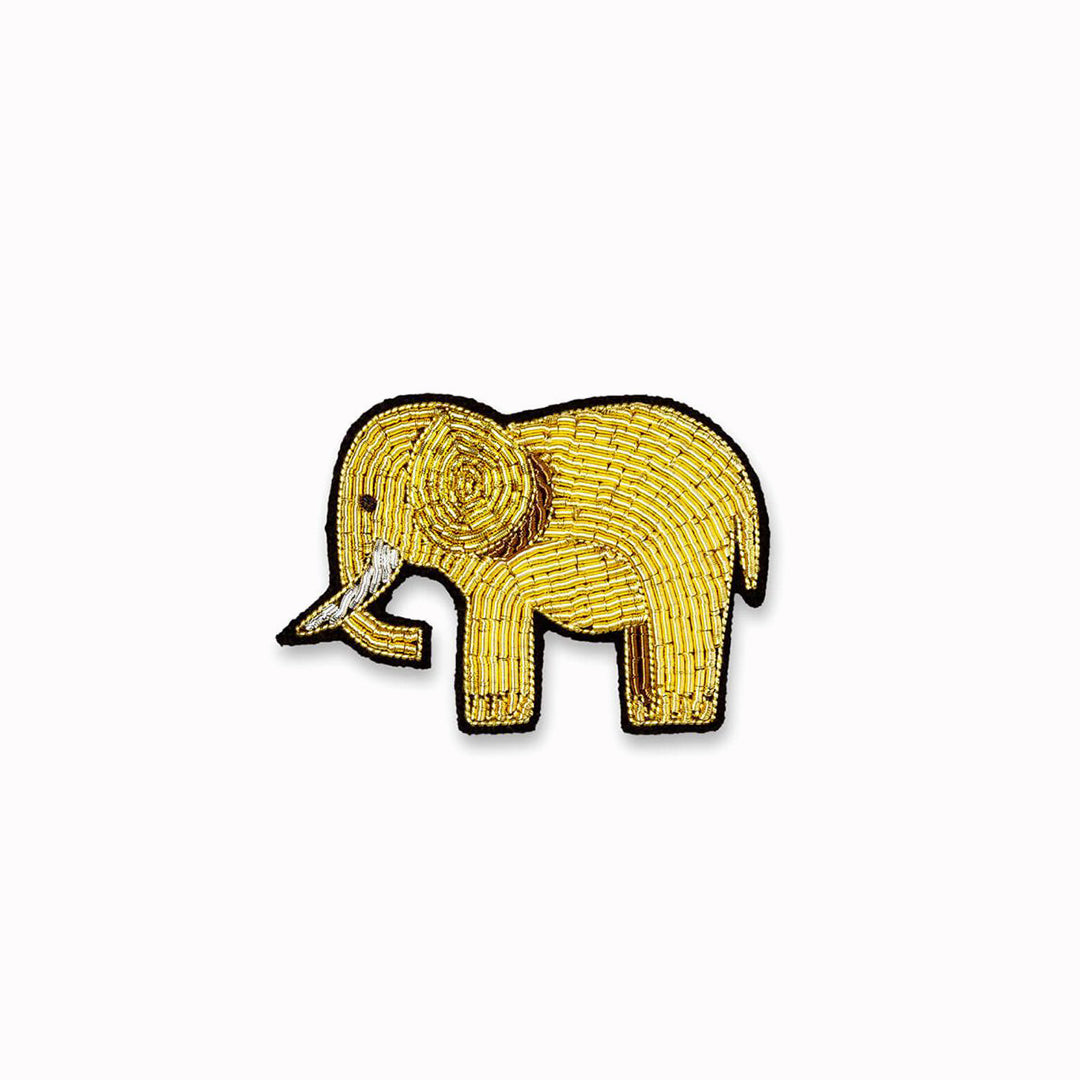 A beautifully hand-embroidered gold elephant lapel pin.From Macon & Lesquoy, French Hand Embroidered badges and patches using Cannetille thread.