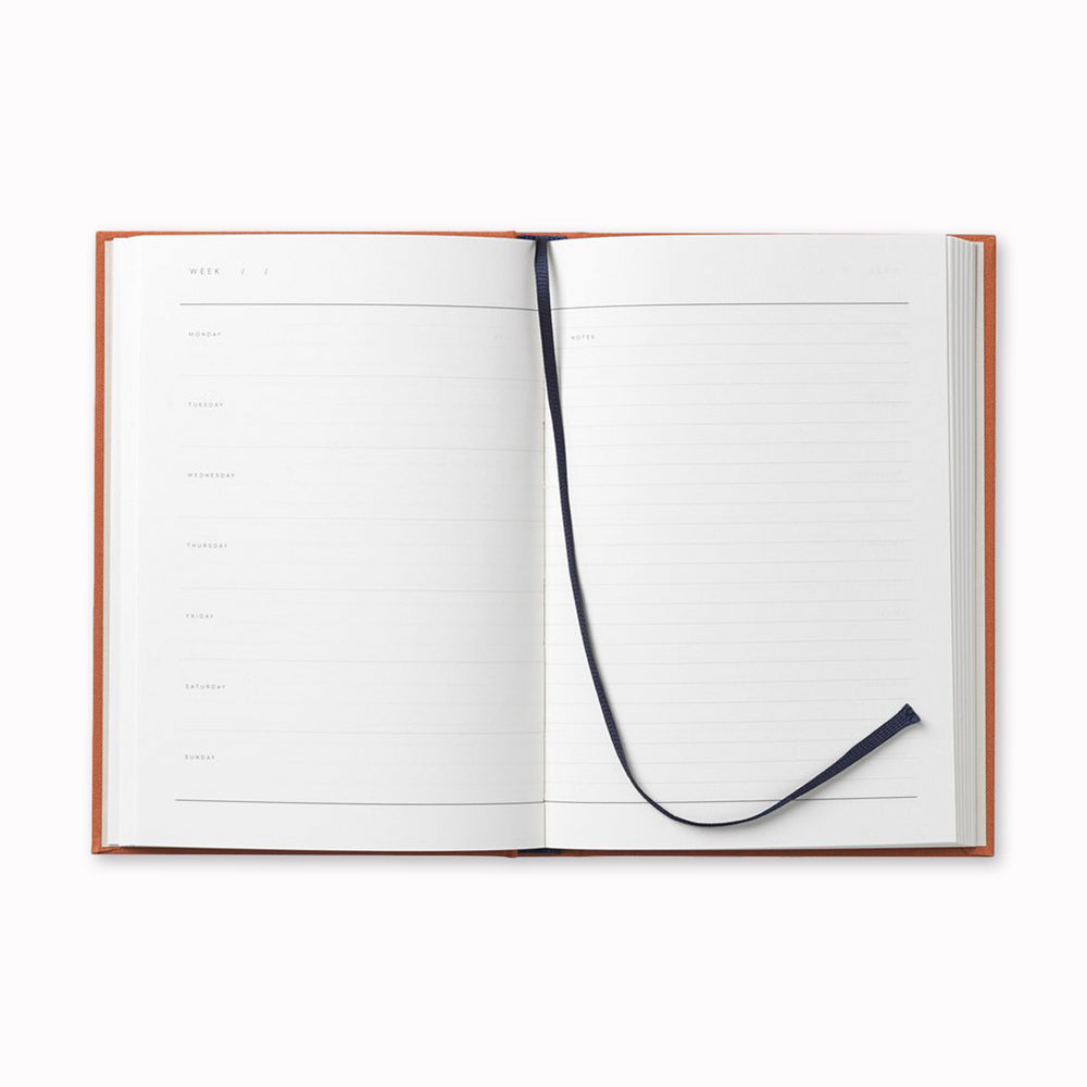 Inside spread of lined pages of Notem Even Weekly Journal, A stylish and functional notebook that helps you organize your thoughts and ideas. Days are listed on the left and notes are on the right hand side. It contains areas for contacts and a yearly overview as well as notes and lists.