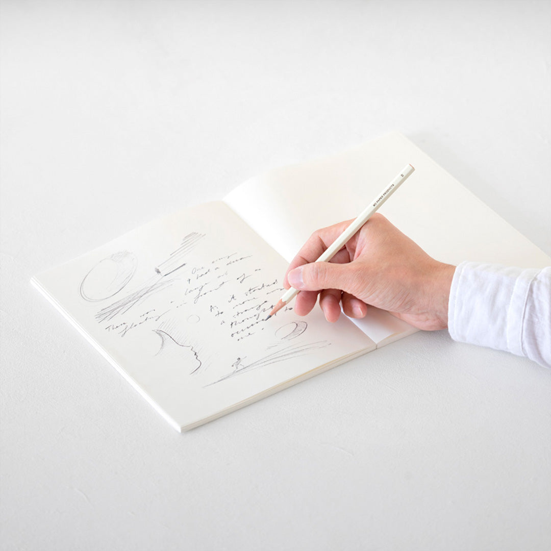 MD Paper Notebook Cotton F2. MD Notebook Cotton is designed to provide the best possible comfort when drawing. The soft cotton paper allows pencil and paint to spread smoothly, and the unique texture of the paper adds to the pleasure of drawing. Open sketchbook with hand drawing.