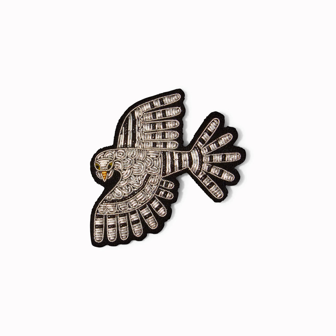 An intricately designed, hand-embroidered Falcon lapel pin, From Macon & Lesquoy, French Hand Embroidered badges and patches using Cannetille thread.