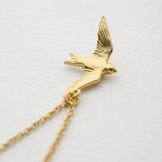 A delicately detailed flying swallow necklace from Alex Monroe's Classics jewellery collection.