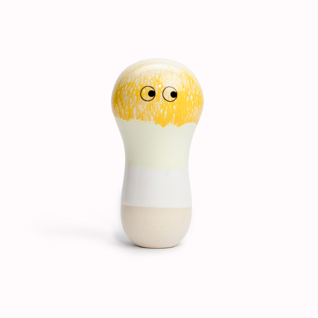 Yellow Gaba |  A curvy light bulb shaped, hand glazed ceramic figurine created as a close relative of the classic Arhoj Ghost. The Familia is a continuation of the playful decorative object series from Studio Arhoj. 