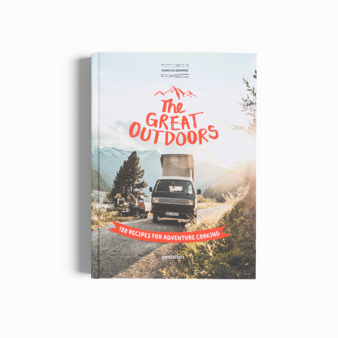 The Great Outdoors Cookbook, cover, camper van at idyllic picnic spot. 120 recipes for adventure cooking! This book explains how to cook on an open fire and presents the best outdoor cooking equipment and the most delicious recipes for different meals of the day.