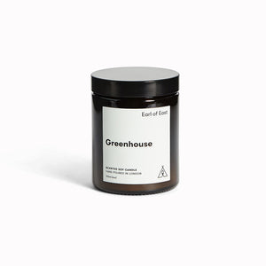 Greenhouse candle by Earl Of East. A beautiful and fresh combination of green leaves, parsley seed, basil and lemon zest. Inspired by Earl Of East co-founder Niko's summers in Greece, and specifically the delicious scent of Niko's grandmother's sun-drenched sweet tomatoes.