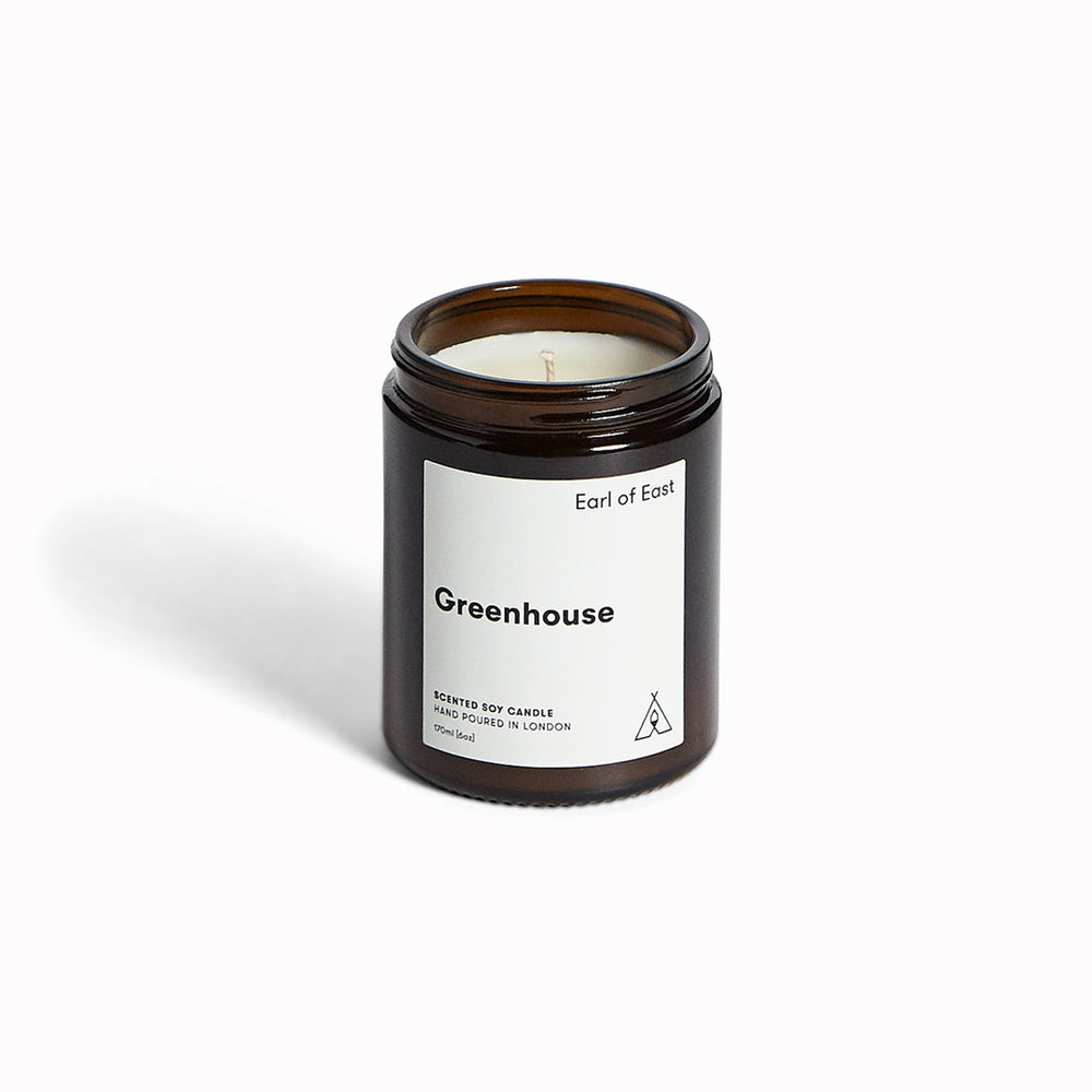 Greenhouse candle by Earl Of East. A beautiful and fresh combination of green leaves, parsley seed, basil and lemon zest. Inspired by Earl Of East co-founder Niko's summers in Greece, and specifically the delicious scent of Niko's grandmother's sun-drenched sweet tomatoes.