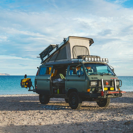 Hit The Road- Vans, Nomads and Roadside Adventures book by Gestalten, detail, van on beach. Hit the road! - Vans, Nomads and Roadside Adventures. A weekend trip, a longer vacation off the beaten track, or a nomadic journey around the globe. This book features vans, overland vehicles, and their passionate owners—and celebrates a life on the move.